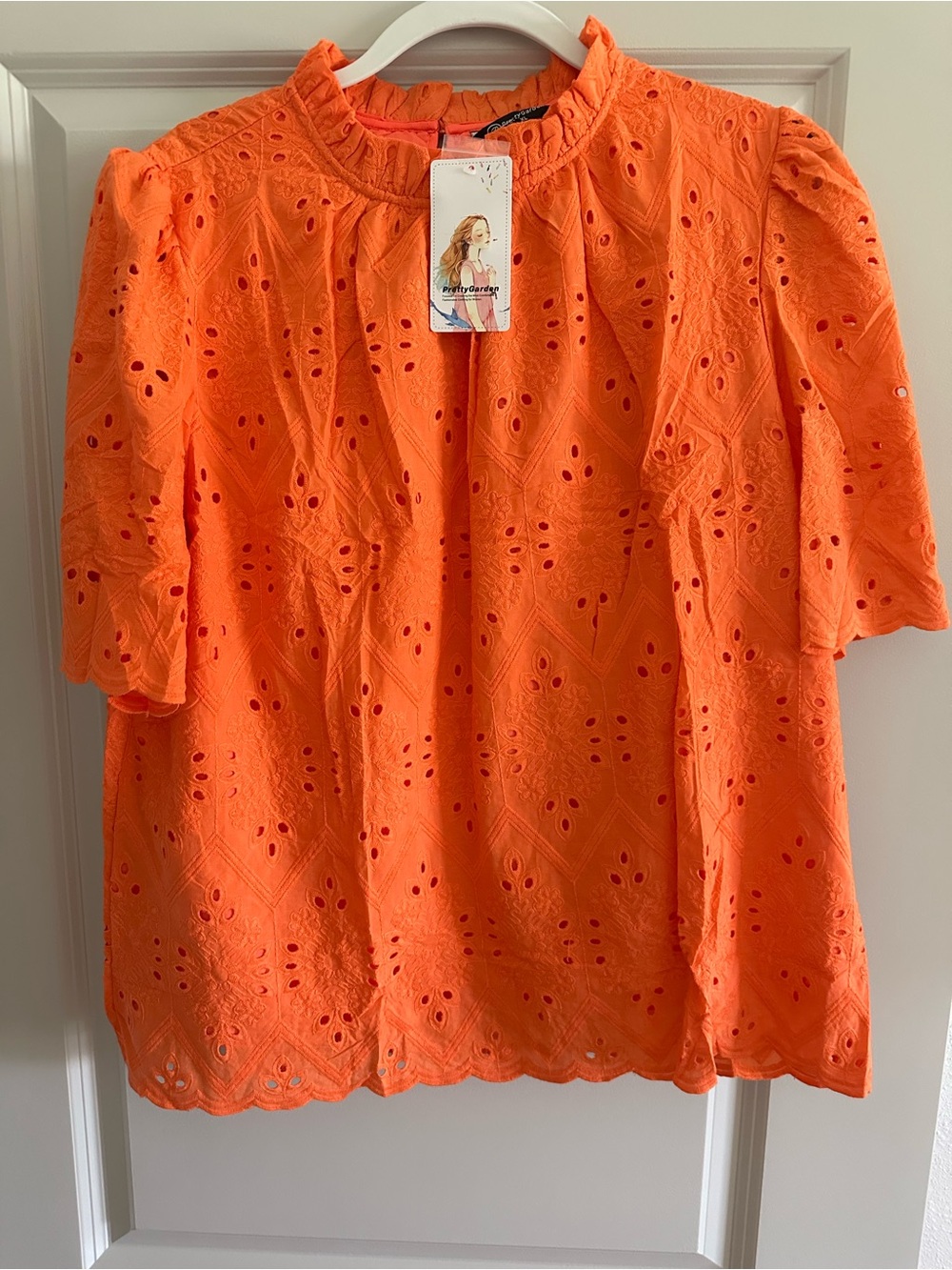 Women's Orange Eyelet Ruffle-Neck Blouse